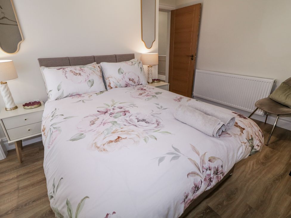 A bedroom with a bed and nightstand at 41 Church view Portstewart