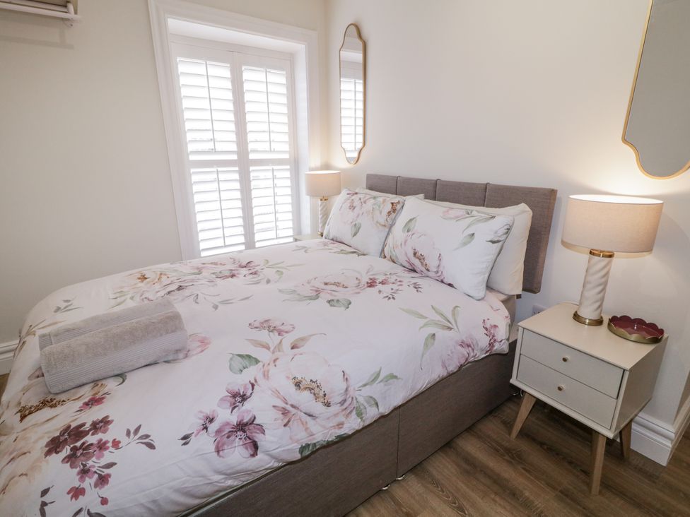 A bedroom with a bed and bedside table at 41 Church view, Portstewart