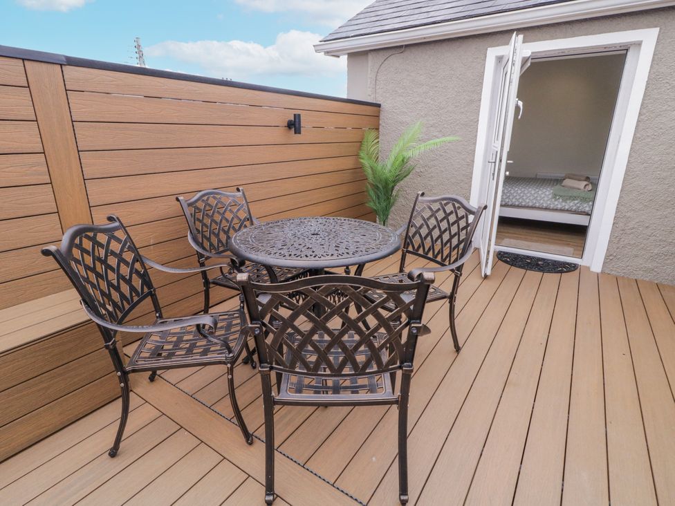 An outdoor space with a table and chairs at 41 Church view Portstewart