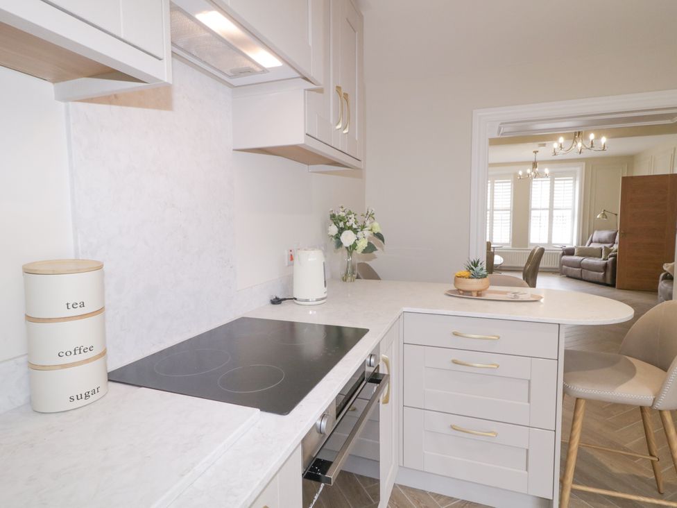 A kitchen with cabinets countertops and stove at 41 Church view Portstewart, County Londonderry