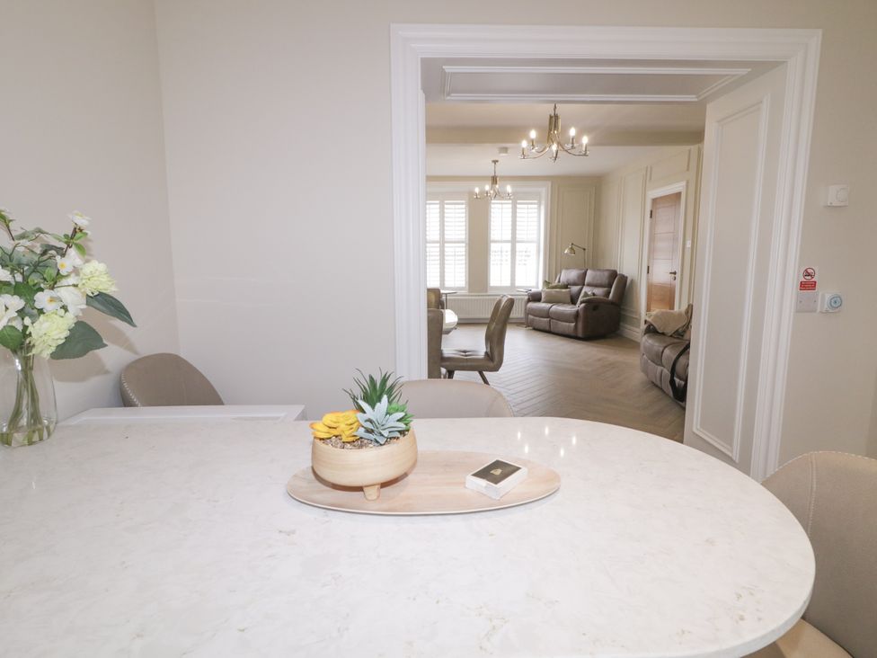 A dining room with a view of a living room at 41 Church view, Portstewart, County Londonderry