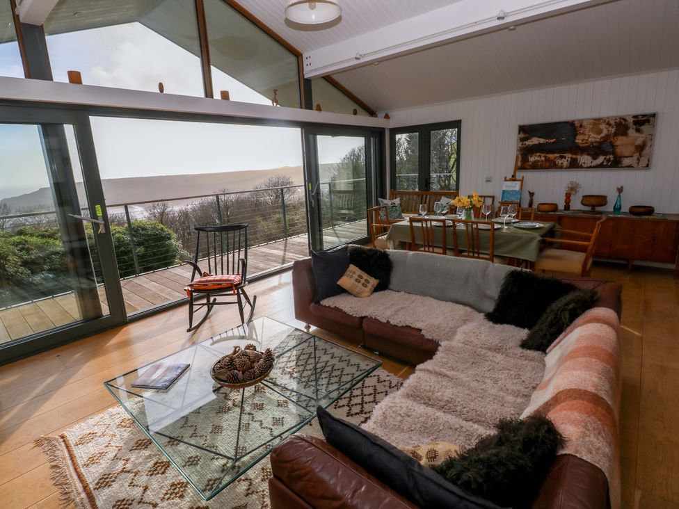 A living room with a sofa and a coffee table at Green Shutters in Freshwater East near Lamphey