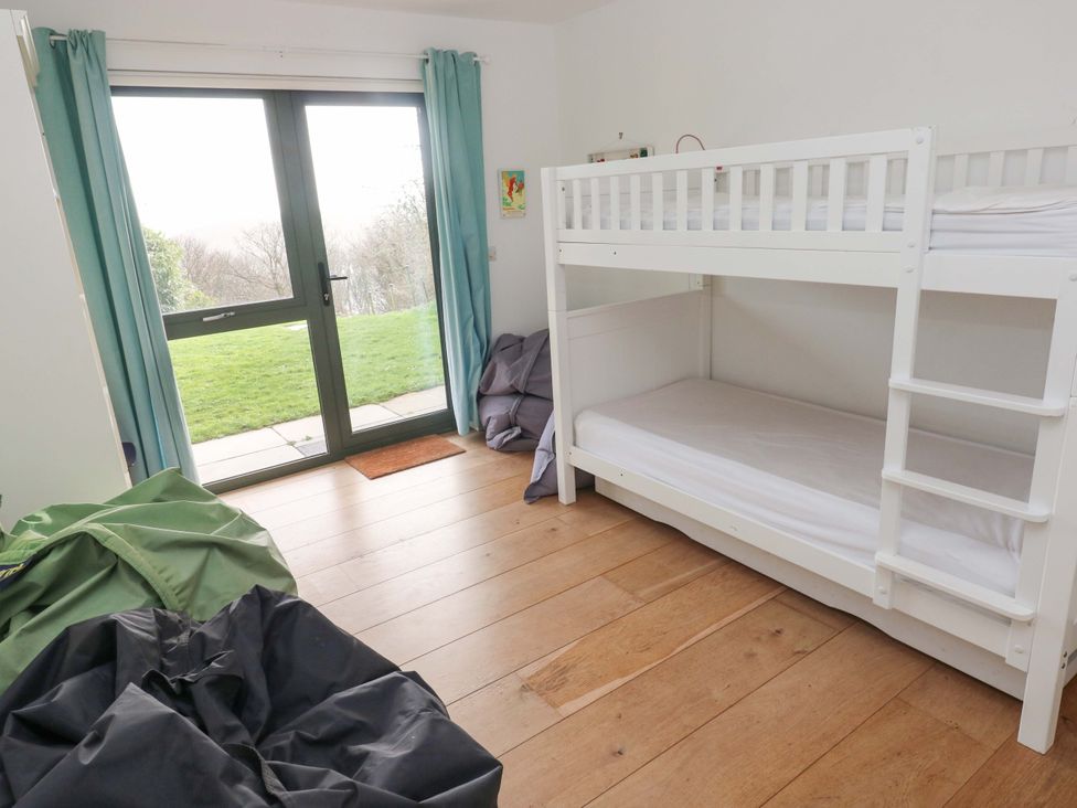 A bedroom with a bunk bed and bean bags at Green Shutters Freshwater East near Lamphey