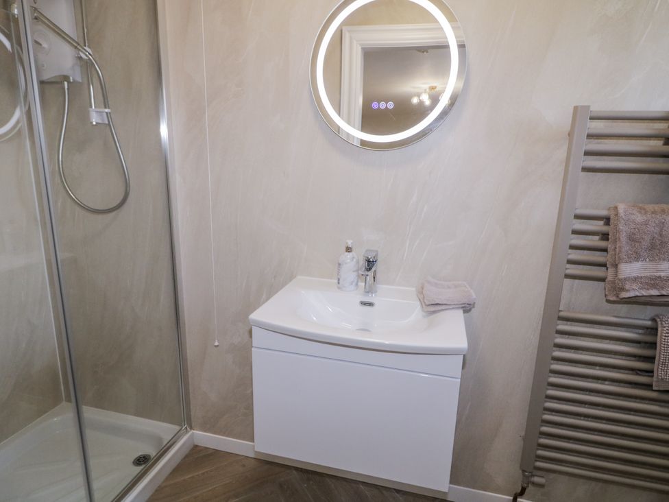A bathroom with a shower and sink at Church Studio in Portstewart
