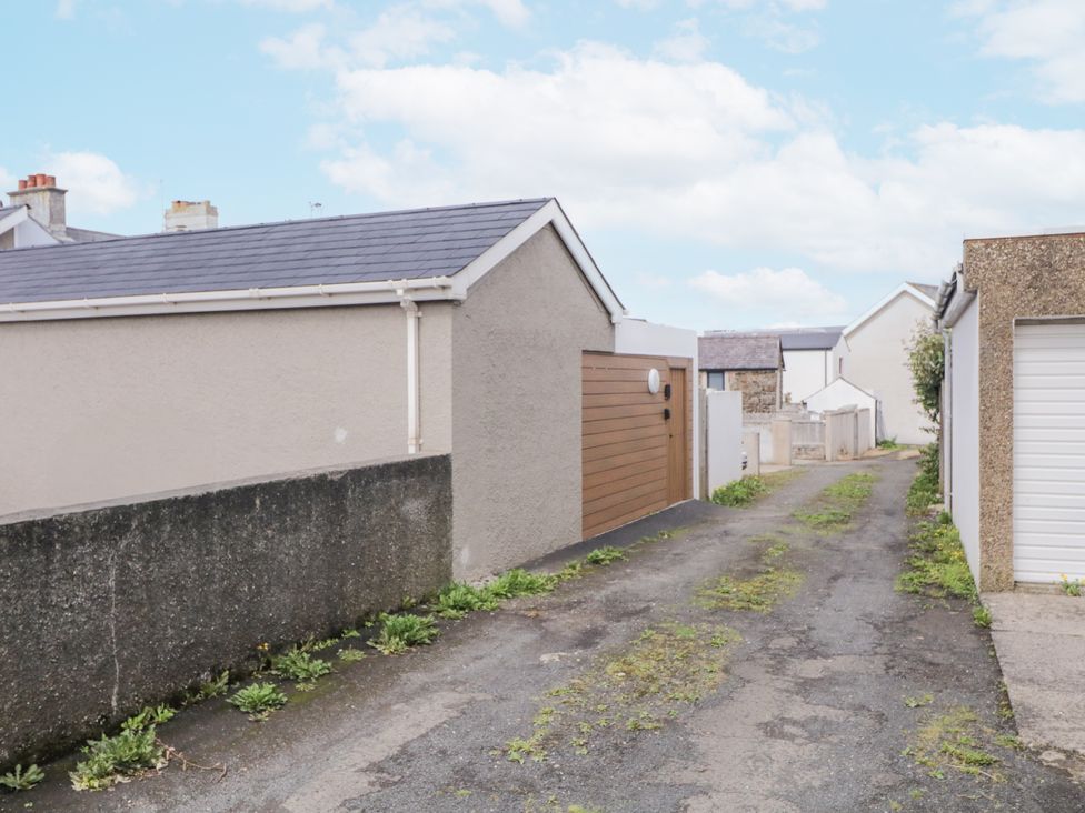 An outdoor area with a pathway leading between buildings at Church Studio, Portstewart, County Londonderry