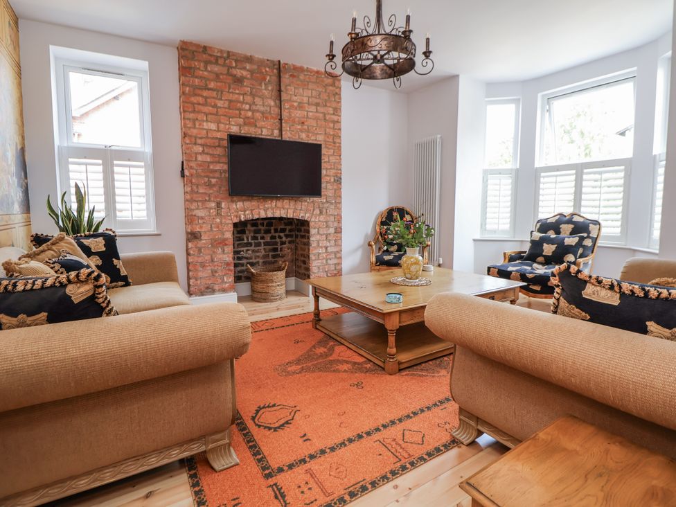 A living room with a television and fireplace at 33 Lorne Street in Chester