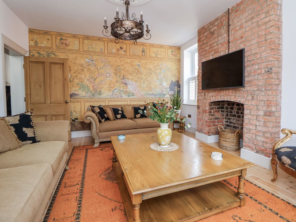 A living room with a sofa and a table at 33 Lorne Street Chester