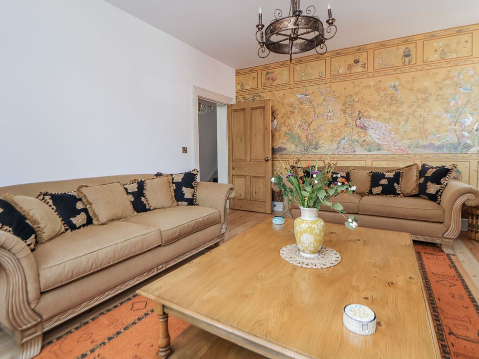 A living room with sofas and a wooden table at 33 Lorne Street Chester