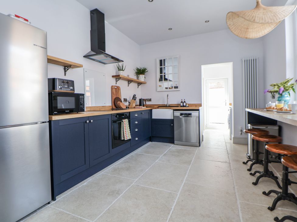 A kitchen with appliances and seating at 33 Lorne Street Chester