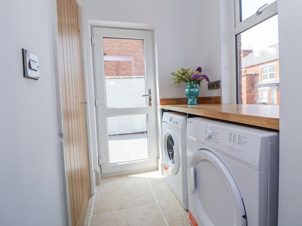A laundry room with a washing machine and dryer at 33 Lorne Street Chester