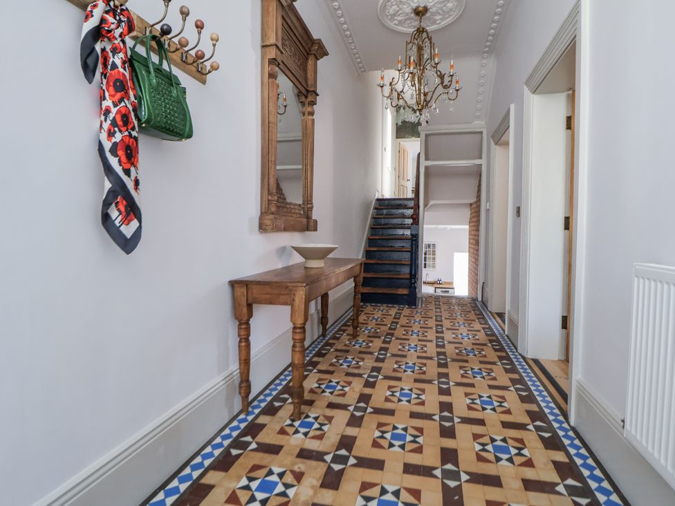 A hallway with a coat rack and mirror at 33 Lorne Street in Chester