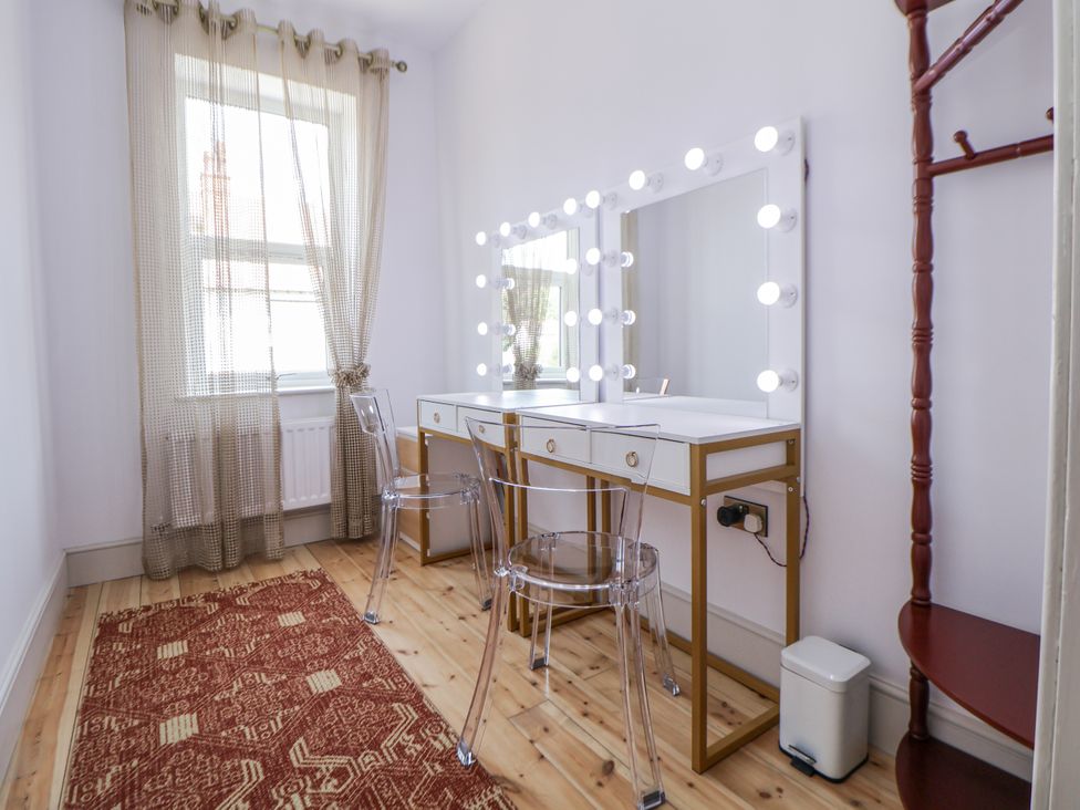 A dressing room with vanity table and mirrors at 33 Lorne Street Chester