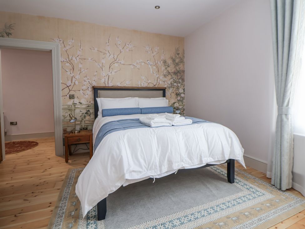 A bedroom with a bed and nightstand at 33 Lorne Street in Chester