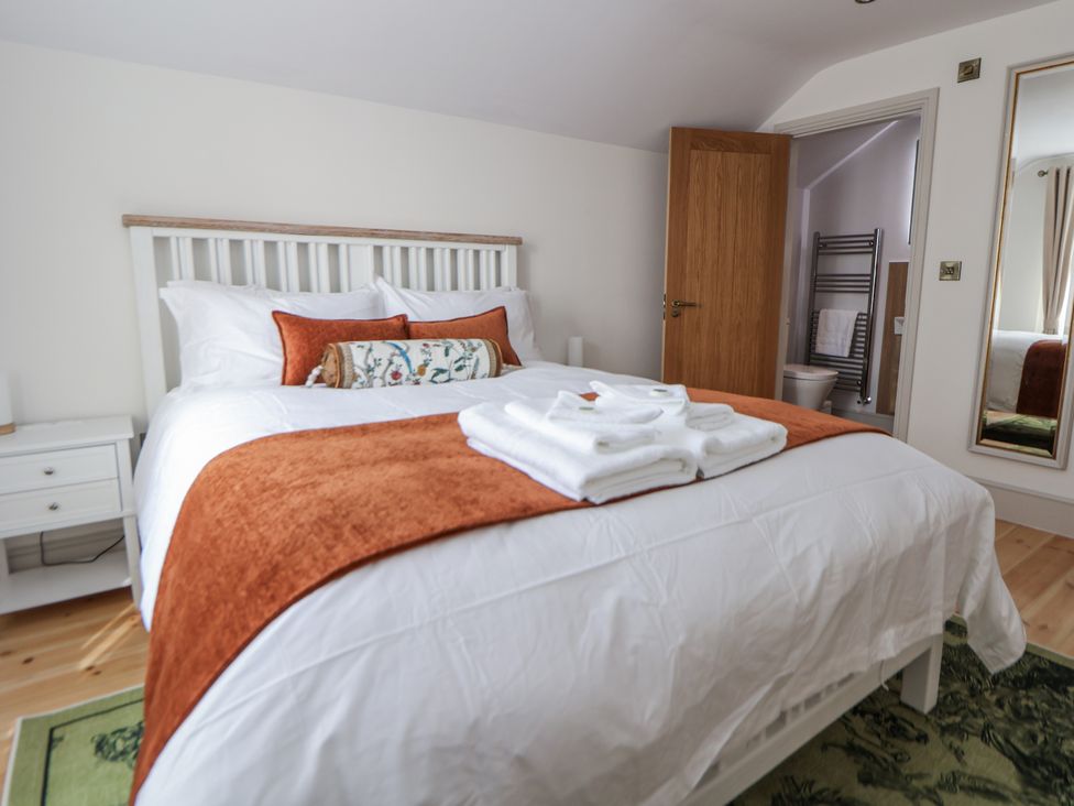 A bedroom with a bed and adjacent bathroom at 33 Lorne Street Chester