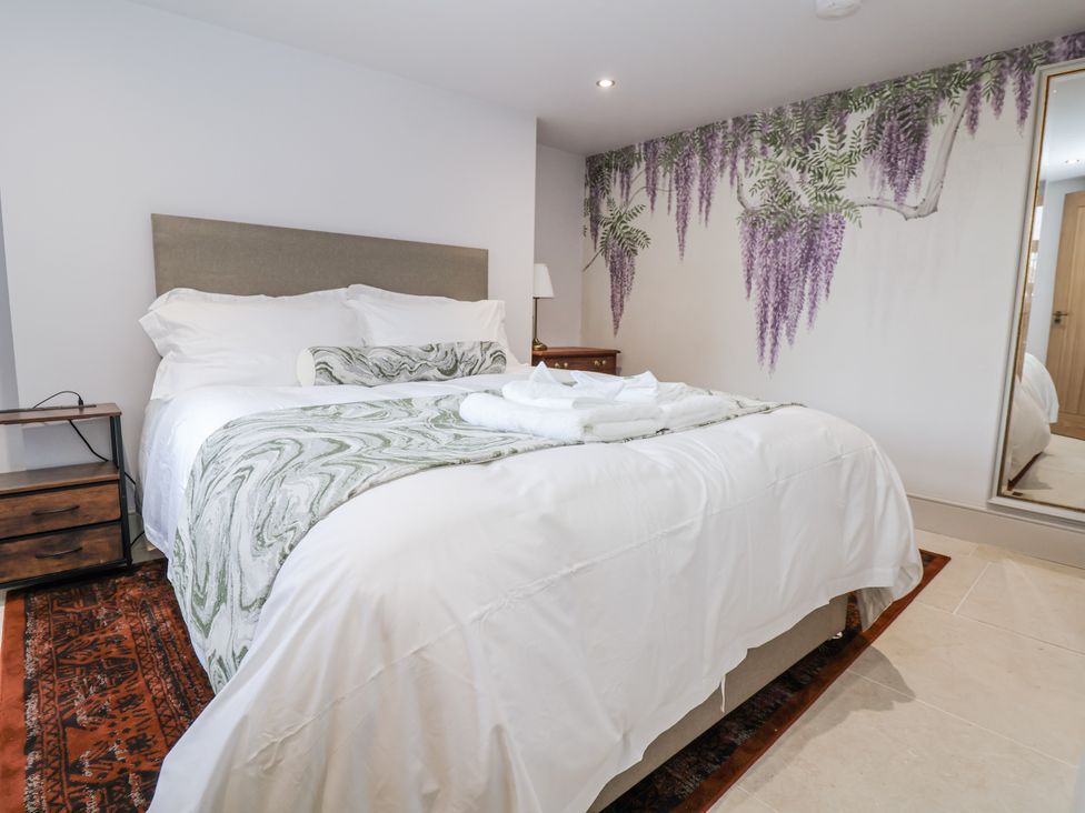A bedroom with a bed and side table at 33 Lorne Street Chester