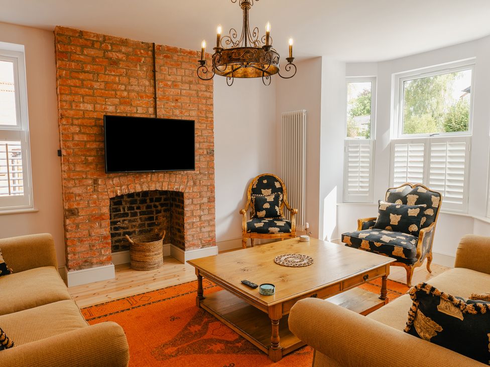 A living room with a television and coffee table at 33 Lorne Street Chester