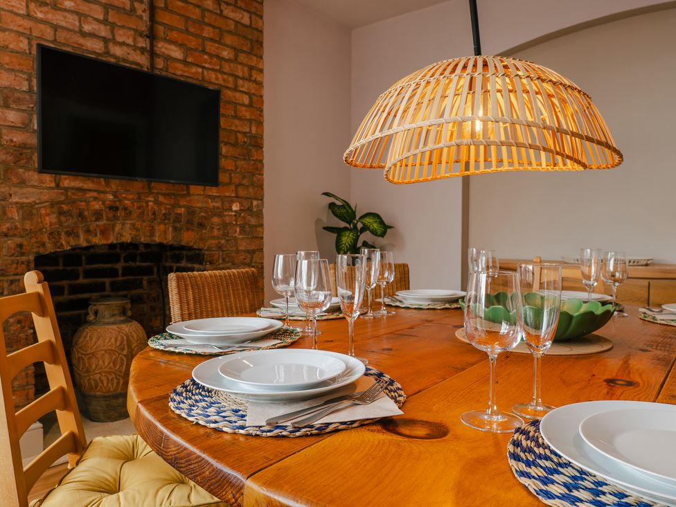A dining room with a wooden table and chairs at 33 Lorne Street Chester