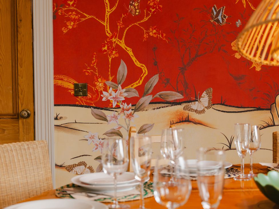 A dining room with a decorative wall and table setting at 33 Lorne Street Chester