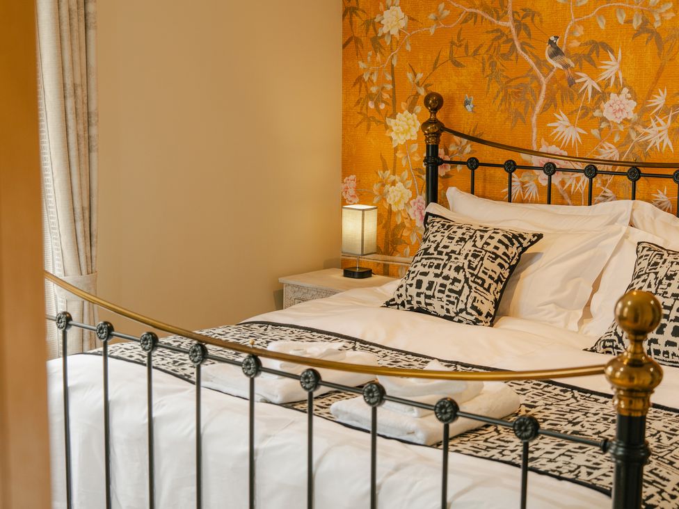 A bedroom with a bed and bedside lamp at 33 Lorne Street in Chester