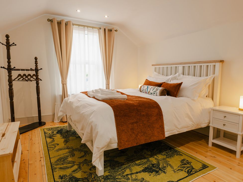 A bedroom with a bed and clothes rack at 33 Lorne Street Chester