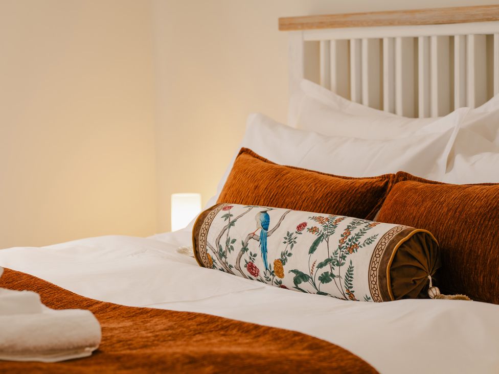 A bedroom with a bed and decorative pillows at 33 Lorne Street in Chester