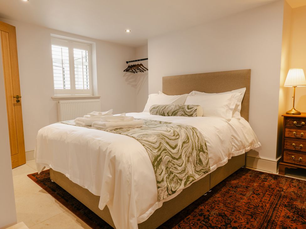 A bedroom with a bed and bedside table at 33 Lorne Street Chester
