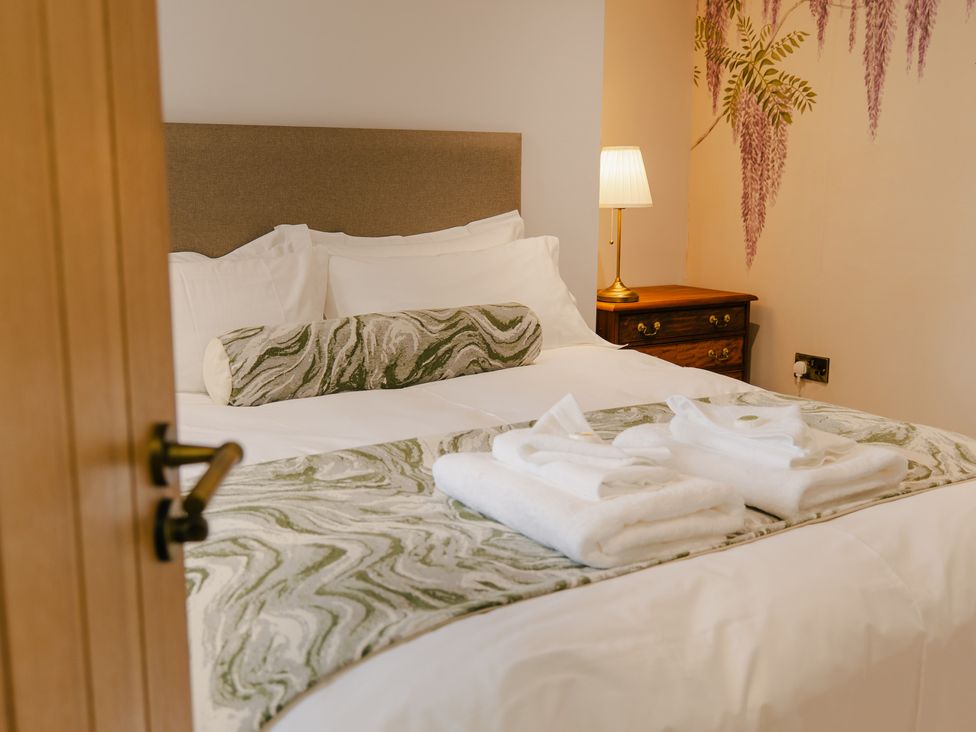 A bedroom with a bed and lamp at 33 Lorne Street Chester