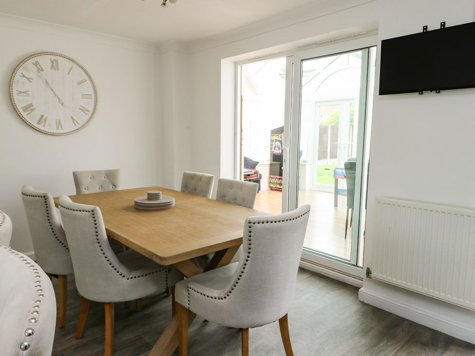 A dining room featuring a table and chairs at 9 Beckett Close Colwyn Bay