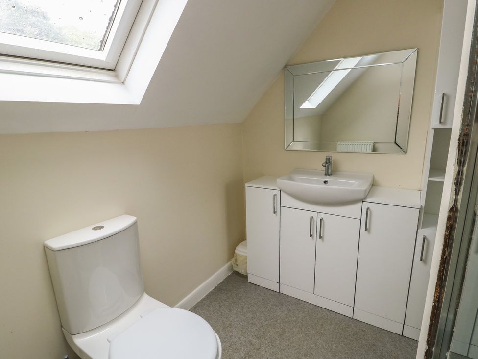 A bathroom with a sink and toilet at 9 Beckett Close in Colwyn Bay