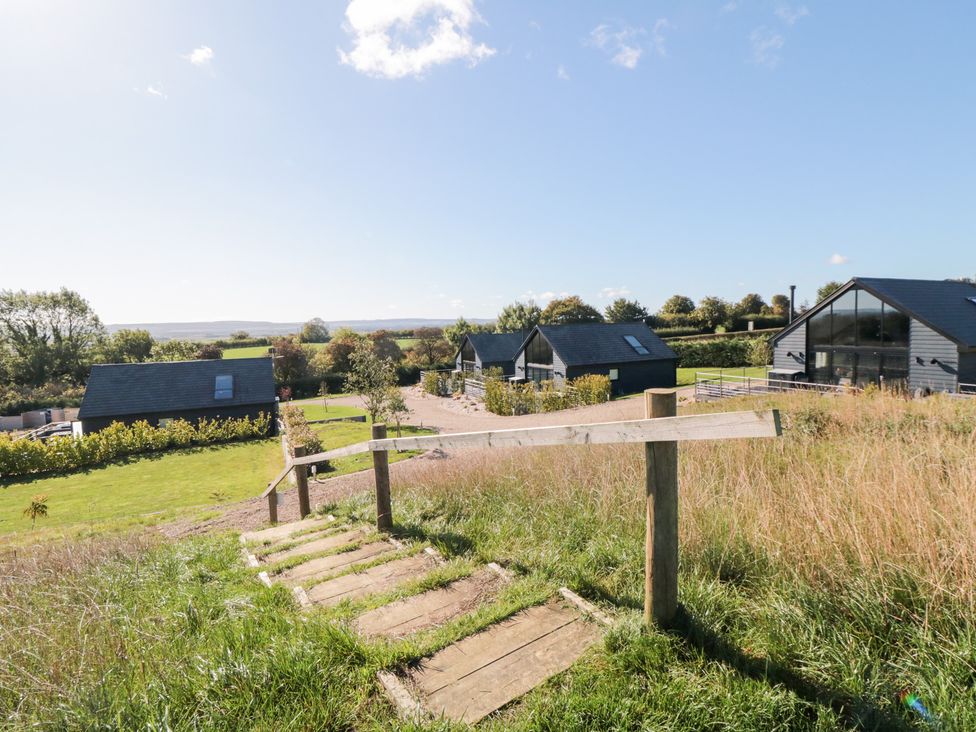 A view of multiple houses and a pathway at Hare's Hill in Thornton-Le-Dale