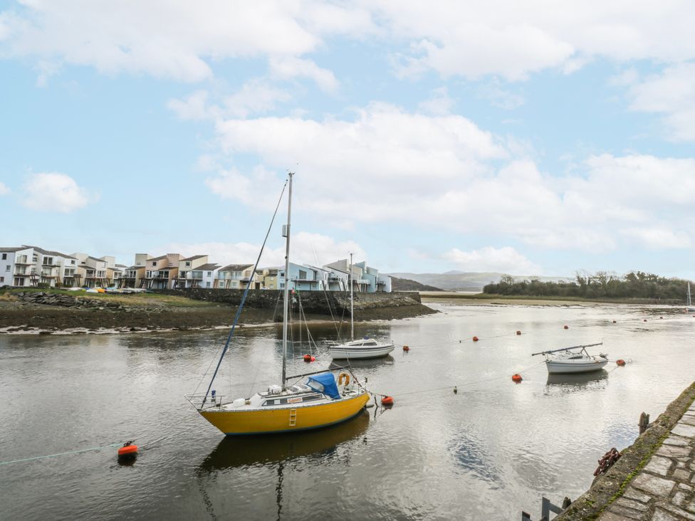 A view of boats in water with houses in the background at Oakley View Apartment Porthmadog