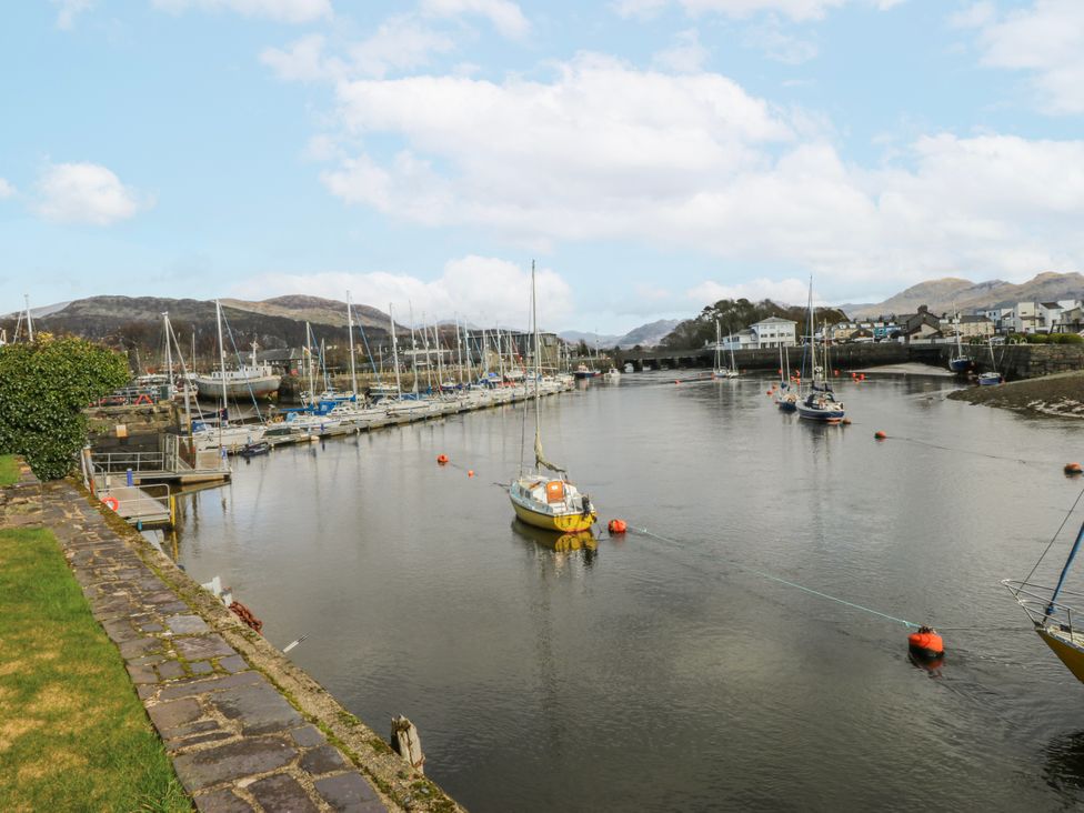A marina with boats in water at Oakley View Apartment in Porthmadog