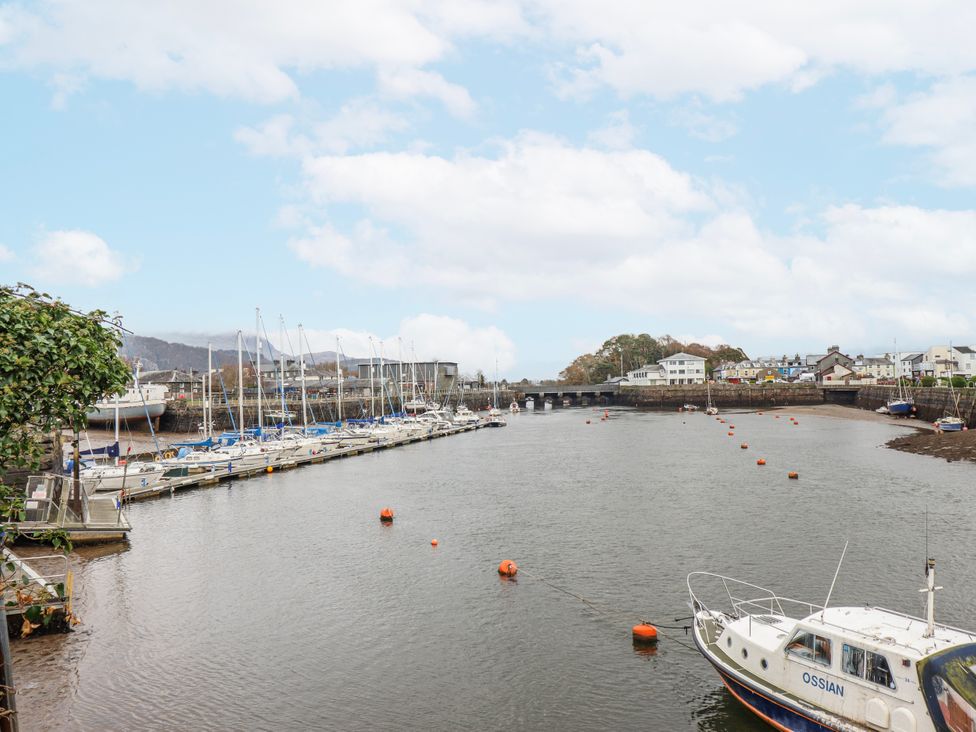 A marina with boats and a bridge at Oakley View Apartment Porthmadog