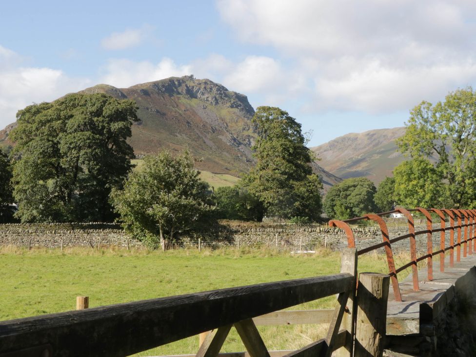 A view of a mountain and trees in a field at 2 Bakers Yard