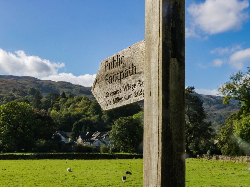 A signpost indicating public footpath near fields at 2 Bakers Yard 