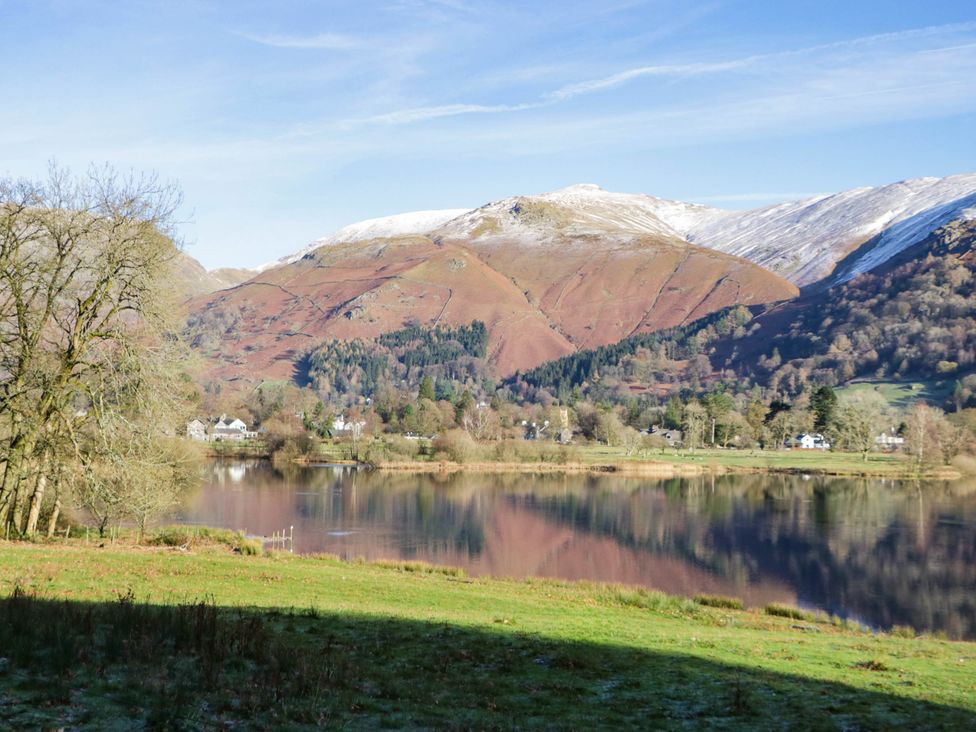 A scenic view of mountains and a lake with trees at 2 Bakers Yard