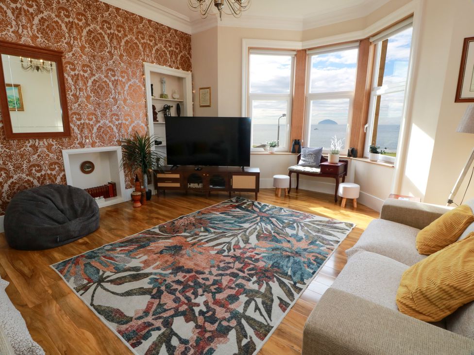 A living room with a television and bean bag at Ailsa View in Girvan