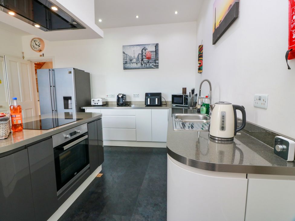 A kitchen with appliances and fixtures at Ailsa View in Girvan