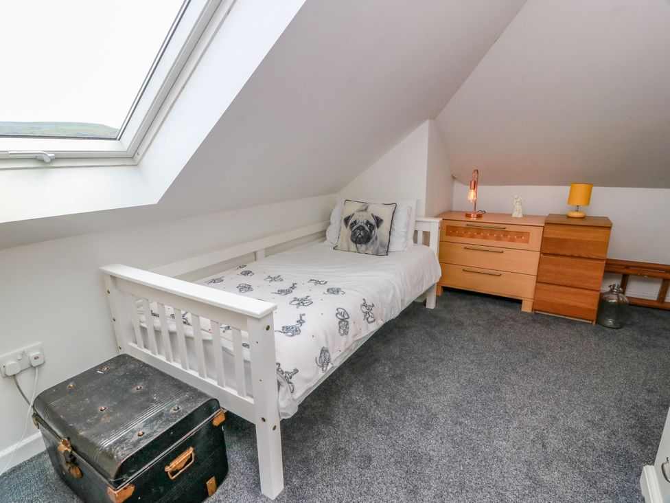 A bedroom with a single bed and dresser at Ailsa View in Girvan