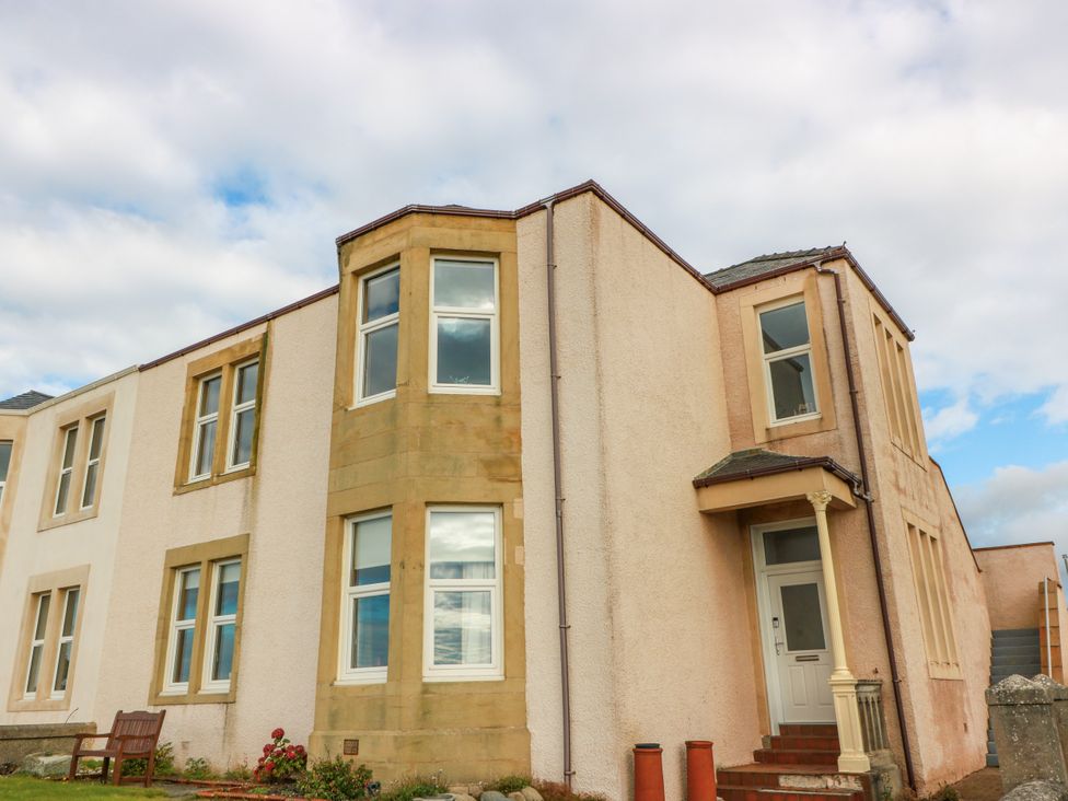 A house exterior with multiple windows and a door at Ailsa View in Girvan