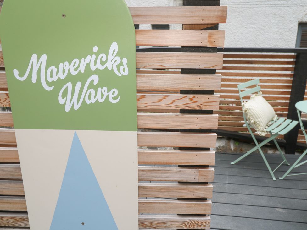 A sign that reads Mavericks Wave in an outdoor area at Mavericks Wave St Agnes