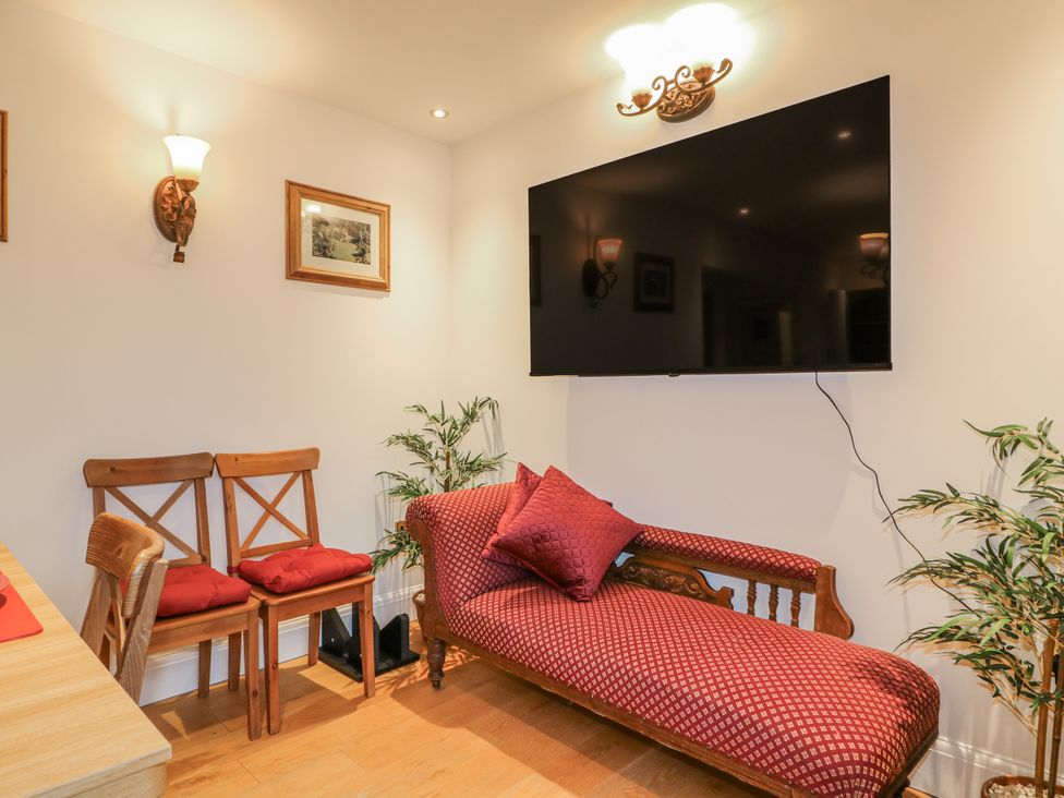 A living room with a sofa and television at Mellbreak in Ashby-De-La-Zouch
