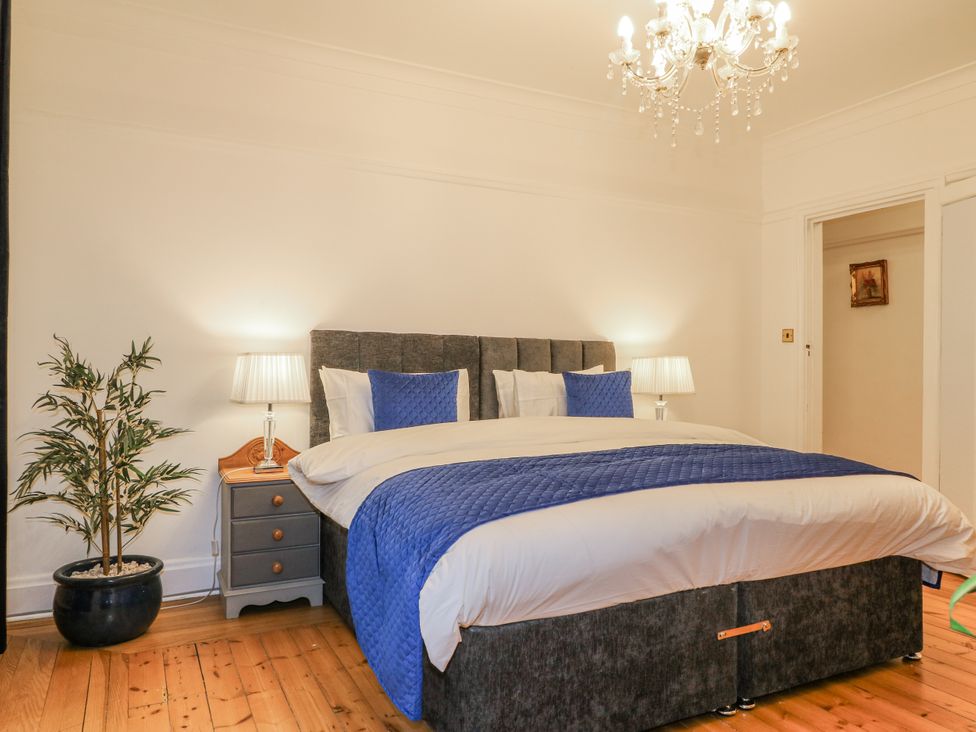 A bedroom with a bed and bedside table at Mellbreak in Ashby-De-La-Zouch