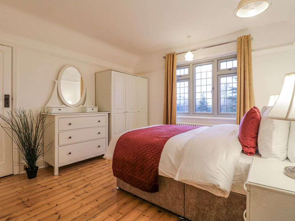 A bedroom with a bed and furniture at Mellbreak in Ashby-De-La-Zouch