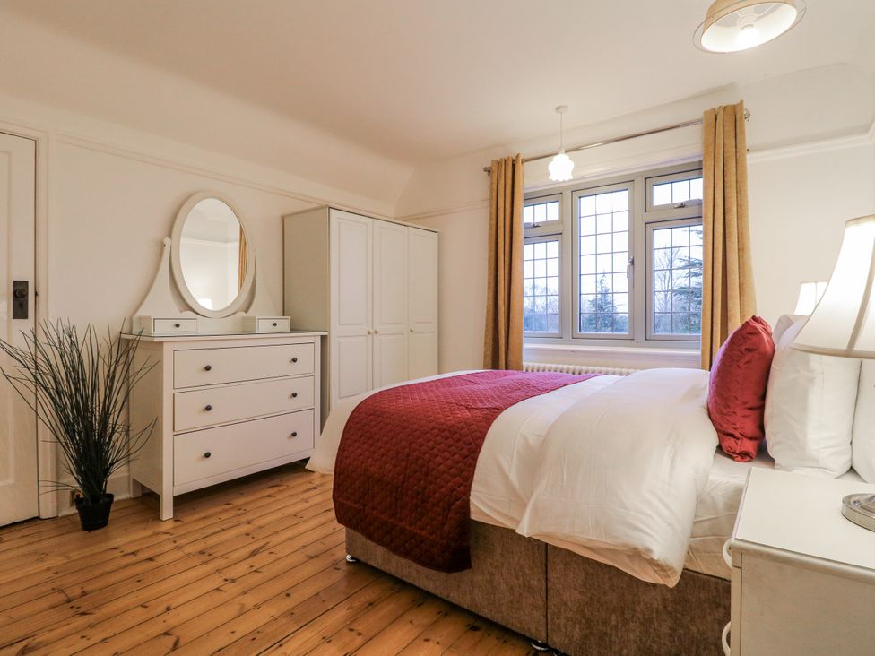 A bedroom with bed and dresser at Mellbreak in Ashby-De-La-Zouch