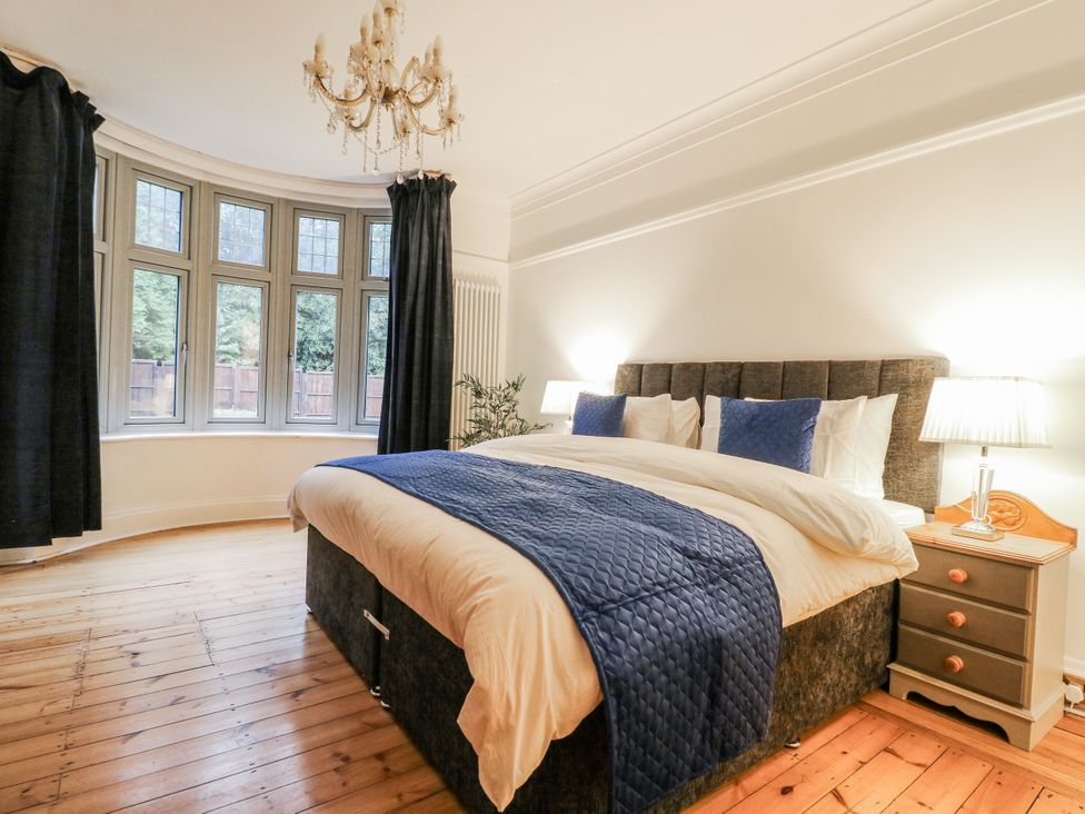 A bedroom with a bed and window at Mellbreak in Ashby-De-La-Zouch