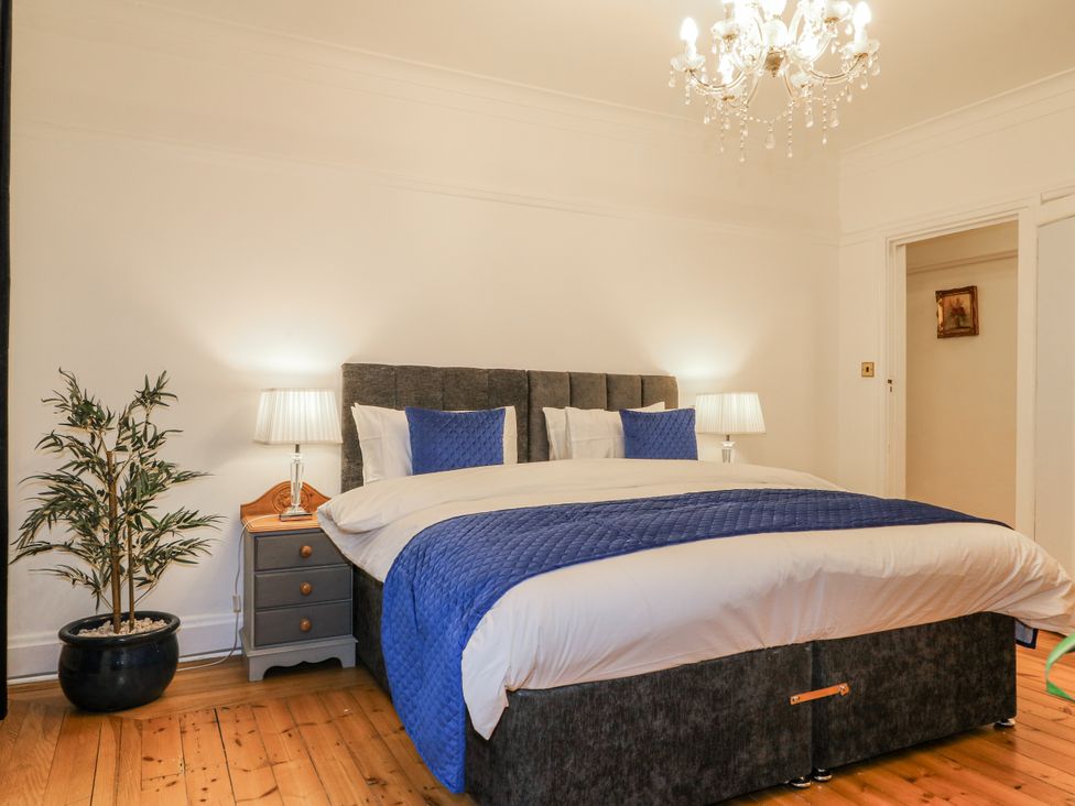 A bedroom with a bed and nightstands at Mellbreak in Ashby-De-La-Zouch