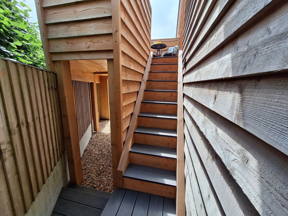 An outdoor area with stairs and a wooden structure at The Halt in Maiden Newton
