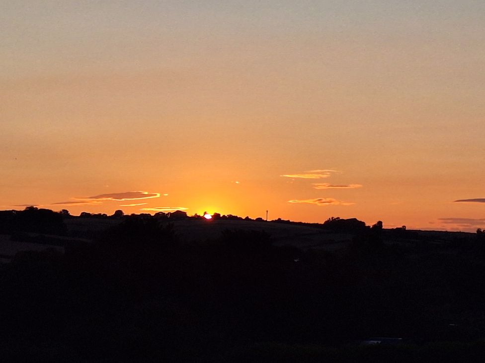 A sunset over the hills at The Halt in Maiden Newton