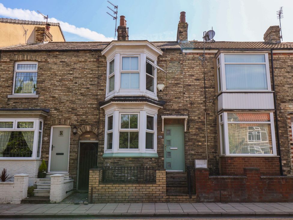 Front view of a house with brick facade and windows at 174 High Street in Marske-By-The-Sea
